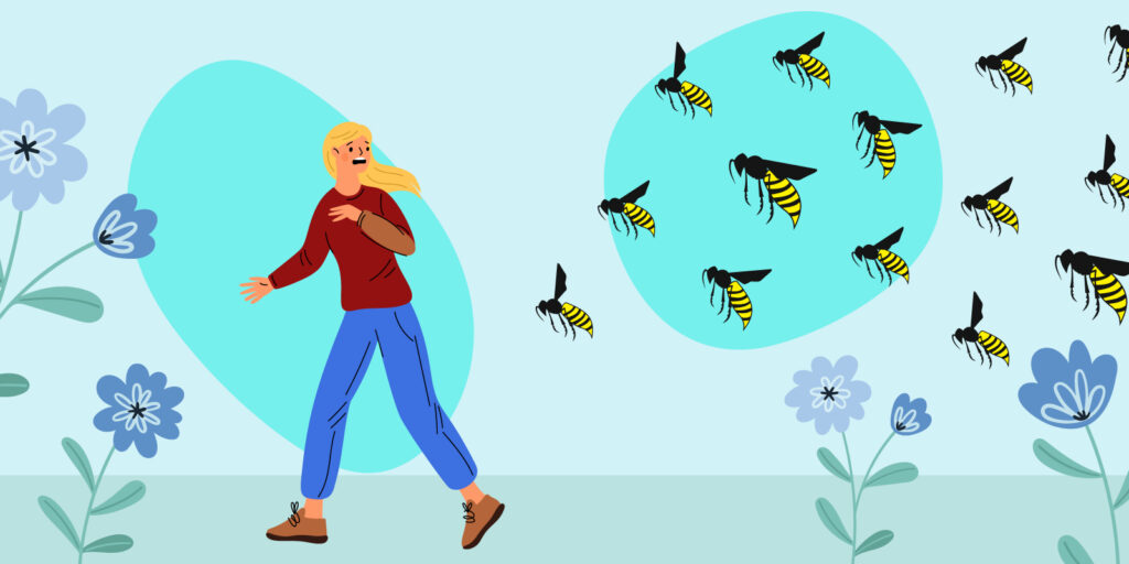 Woman running away from wasps